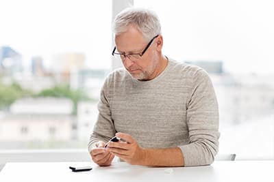 Man using insulin meter